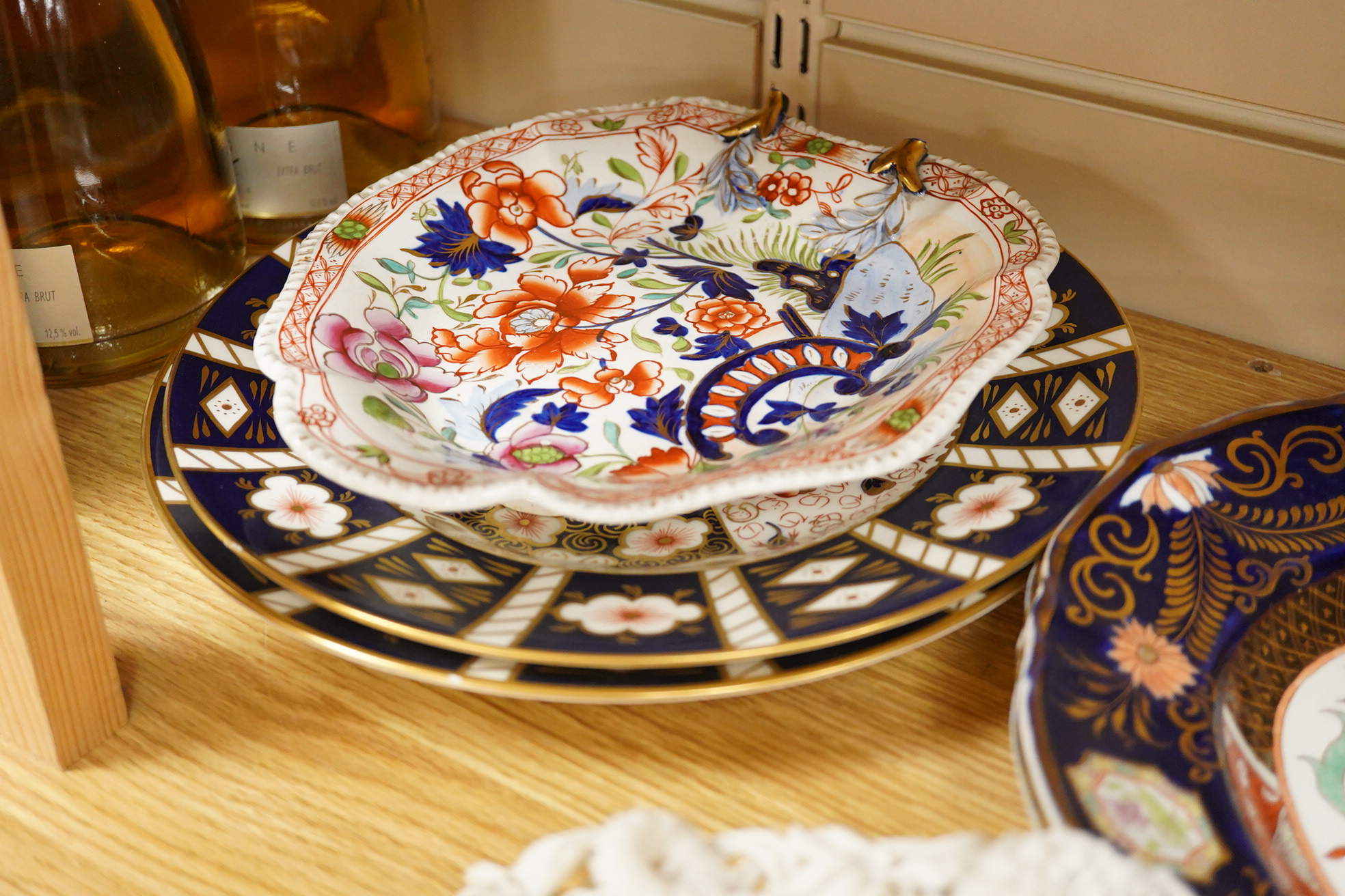 A Belleek porcelain basket, two Masons Ironstone dishes, a pair of Royal Crown Derby Japan pattern dishes and an ironstone leaf shaped dish (6).